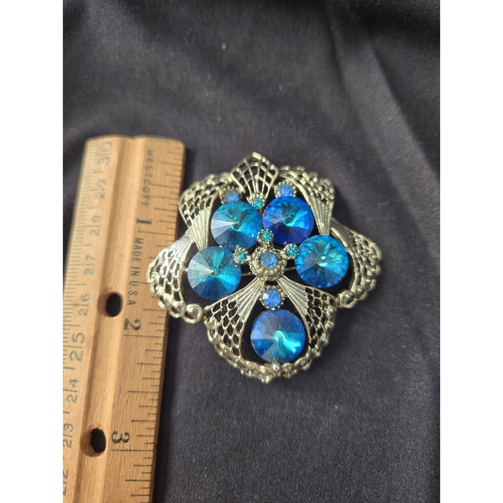 Vintage Crystal Brooch With Blue Crystals And Filigree Metalwork